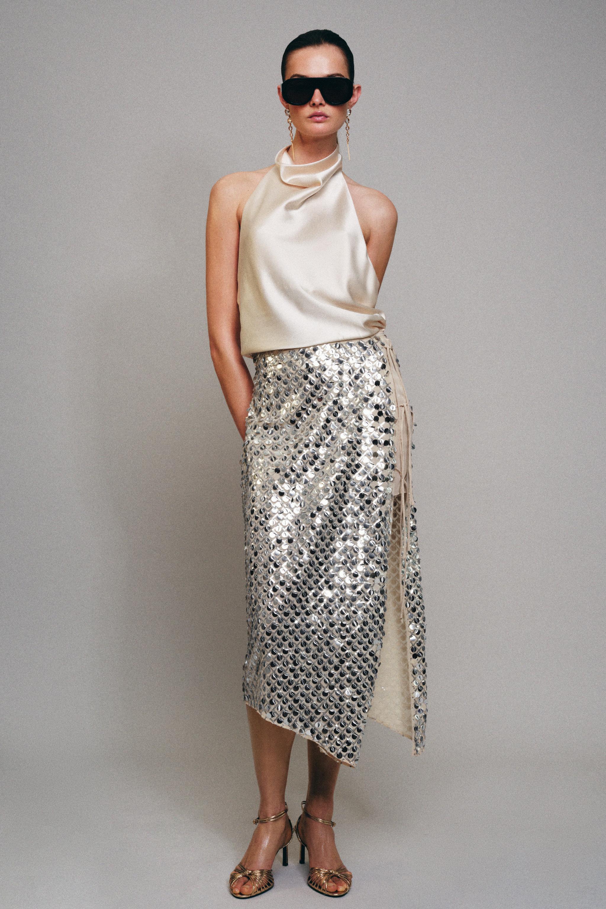 JUPE MI-LONGUE ASYMÉTRIQUE À PAILLETTES